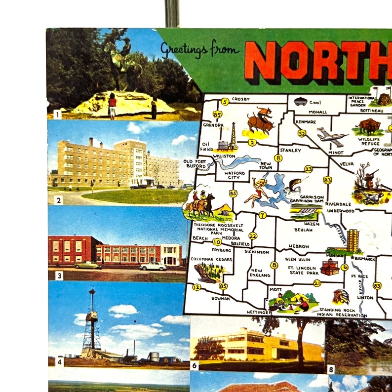 May include: A vintage postcard featuring a map of North Dakota with various cities and towns highlighted. The postcard includes a green border with the text "Greetings from North Dakota".