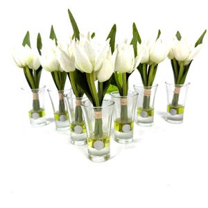 Set of 7 white faux tulip flower arrangements in L Collection glass vases with faux water and twine accents.