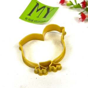 May include: Yellow plastic chick cookie cutter.