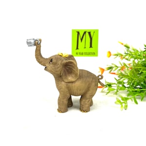Vintage Elephant Figurine - Small Ceramic Elephant with Trunk Up holding a Teacup - HC 1997 - Trunk Up Elephant - My40YearCollection