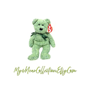 May include: A green plush bear with a dark green ribbon around its neck and a red tag. The bear has a textured appearance and a black nose. The text "My4YearCollection.Etsy.Com" is at the bottom.