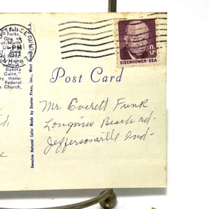 May include: A vintage postcard with a blue "Post Card" inscription and a handwritten address to Mr. Everett Funk, Longview Beach Rd., Jeffersonville, NY. The postcard has a 4-cent Eisenhower stamp.