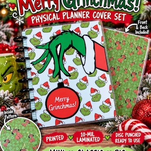 May include: A physical planner cover set featuring a green character wearing a Santa hat, holding a red ornament with the text Merry Grinchmas. The set includes a back cover with a green pattern of a brown dog with antlers and a red nose.