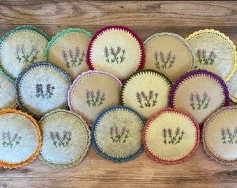 May include: A collection of 14 round lavender-scented sachets with crocheted trim in various colors, including orange, green, blue, red, and brown.