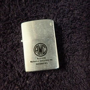 Vintage ZIPPO 16 Hole Advertising Lighter AMC Associated Mechanical Contractors Inc. Greensboro NC