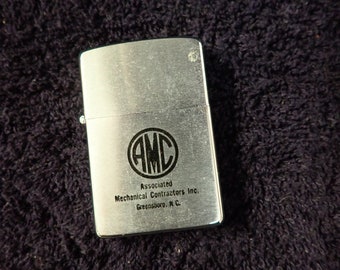 Vintage ZIPPO 16 Hole Advertising Lighter AMC Associated Mechanical Contractors Inc. Greensboro NC