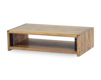 May include: A wooden audio rack with a natural finish. The rack has two shelves and black metal mounting rails on the sides. The wood grain is visible, and the rack is designed to hold audio equipment.