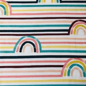 May include: A fabric pattern featuring horizontal stripes in various colors, including pink, yellow, teal, and burgundy. The design incorporates stylized rainbow shapes, creating a cheerful and whimsical aesthetic. The fabric is likely used for home decor or apparel.
