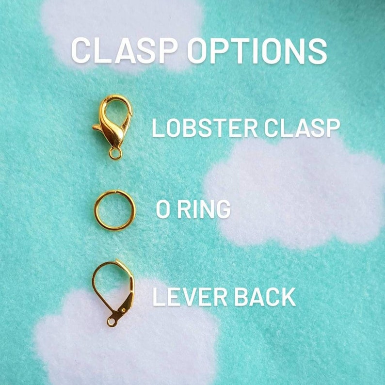 May include: Three gold-colored clasps: a lobster clasp, an O ring, and a lever back clasp. Clasp Options text is at the top of the image.