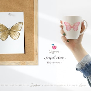 Puede incluir: Una ilustraci&oacute;n digital de una mariposa rosa con detalles dorados en una taza blanca. La taza est&aacute; siendo sostenida por una mano que lleva una camisa vaquera azul.