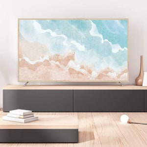May include: A modern living room interior with a flat screen TV displaying a watercolor painting of a beach scene. The TV is on a dark grey entertainment center with a wooden top. There is a wooden coffee table with a stack of books on it. A white lamp is on the floor.