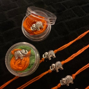Hathi rakhis orange and silver