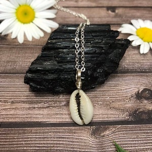 Dainty cowrie shell choker on silver plated wire necklace