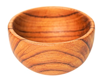 May include: A small, round wooden bowl with a natural wood grain finish. The bowl is empty and has a smooth, polished surface.