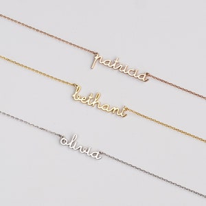 May include: Three delicate gold necklaces with the names "Olivia", "Bethany", and "Patricia" written in cursive.