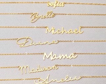 May include: Seven gold necklaces with different names written on them in cursive script. The names are: Sofia, Brielle, Michael, Diana, Mama, Madison, and Amelia.