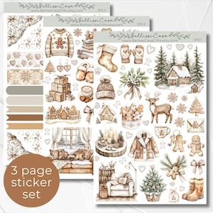May include: A set of three sticker sheets with a winter theme. The stickers feature illustrations of cozy winter scenes, including a cabin in the woods, a fireplace, a deer, a Christmas tree, and a gingerbread house. The stickers are in shades of brown, beige, and white.