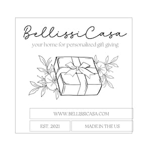 May include: Black and white line drawing of a gift box with a bow, surrounded by flowers. The text "Bellissi Casa" is above the image, and the text "your home for personalized gift giving" is below the image. The text "WWW.BELLISSICASA.COM" is below the image. The text "EST. 2021" and "MADE IN THE US" are below the image.