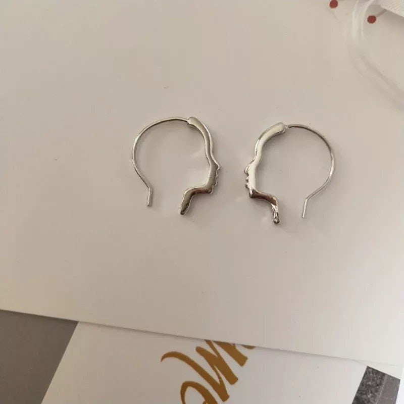 Face outline earrings Clearance