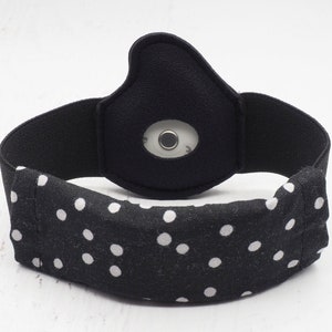 May include: Black headband with white polka dots and a small black sensor patch.