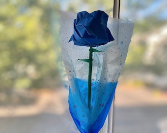 Rain drop / tear drop like sparkly floral decor wrapped around a beautiful blue origami rose with free personalized wood charm!