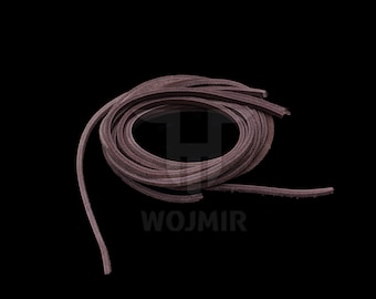 May include: A close-up of a brown leather cord, coiled and ready for use in crafting projects.