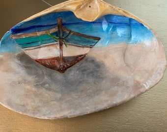 Beautiful Beached wooden boat will be a great addition to a beachy or coastal decor.  This nautical ornament can be laid flat or hung.