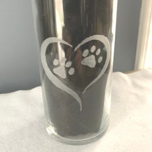 A hand etched dog paws encircled with a heart will beautify any dog lover home.