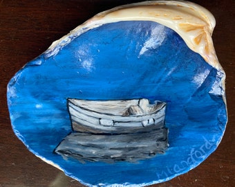 This beachy ornament of a beautiful row boat will add a nautical feel to any coastal beach decor or lake house