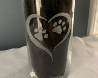 A hand etched dog paws encircled with a heart will beautify any dog lover home.