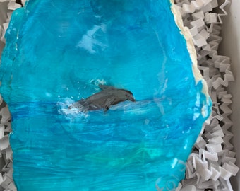 Beatiful beachy decor will add to any nautical themed decor or coastal home.  This hand painted Dolphin in the ocean makes a great gift