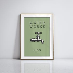 May include: A framed wall art print featuring a sage green background with the black text WATER WORKS at the top, a black and white illustration of a water faucet in the center, and the text &pound;150 printed in black at the bottom of the design.