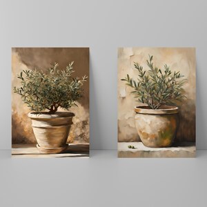 May include: Two paintings of olive trees in terracotta pots against a beige background. The olive trees have green leaves and are in a simple, rustic style.