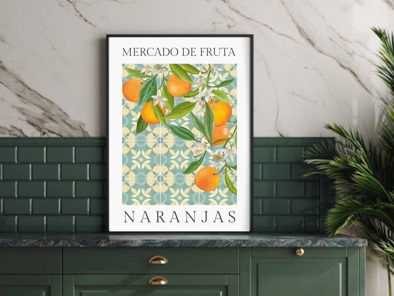 May include: A framed print with a vintage style illustration of oranges and blossoms on a tiled background. The text "Mercado de Fruta" and "Naranjas" is printed in black at the top and bottom of the image.