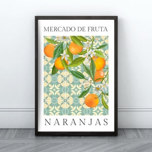 May include: A framed poster with a blue and white tiled background featuring a branch of orange blossoms and oranges. The text "MERCADO DE FRUTA NARANJAS" is printed in black at the top and bottom of the poster.