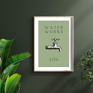 May include: A framed wall art print featuring a sage green background with the black text WATER WORKS centered at the top, a black and white illustration of a water faucet in the middle, and the text &pound;150 printed in black at the bottom.