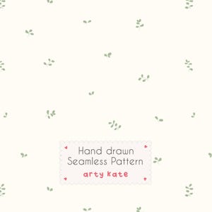 May include: A seamless pattern featuring small, light green leaves scattered on a cream-colored background. The design includes the text "Hand drawn Seamless Pattern arty kate" in a pink and white label.