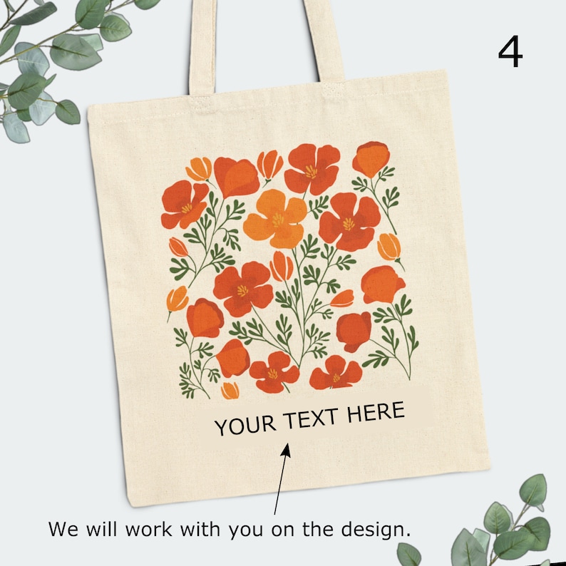 May include: A beige tote bag with a floral design featuring orange and red poppy flowers. The bag has a white text overlay that says "YOUR TEXT HERE".