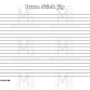 May include: A black and white printable drum stick jig with the text "Drum Stick Jig" at the top and "PLACE JIG IN BOTTOM LEFT CORNER SQUARE TO THE LEFT EDGE" at the bottom.