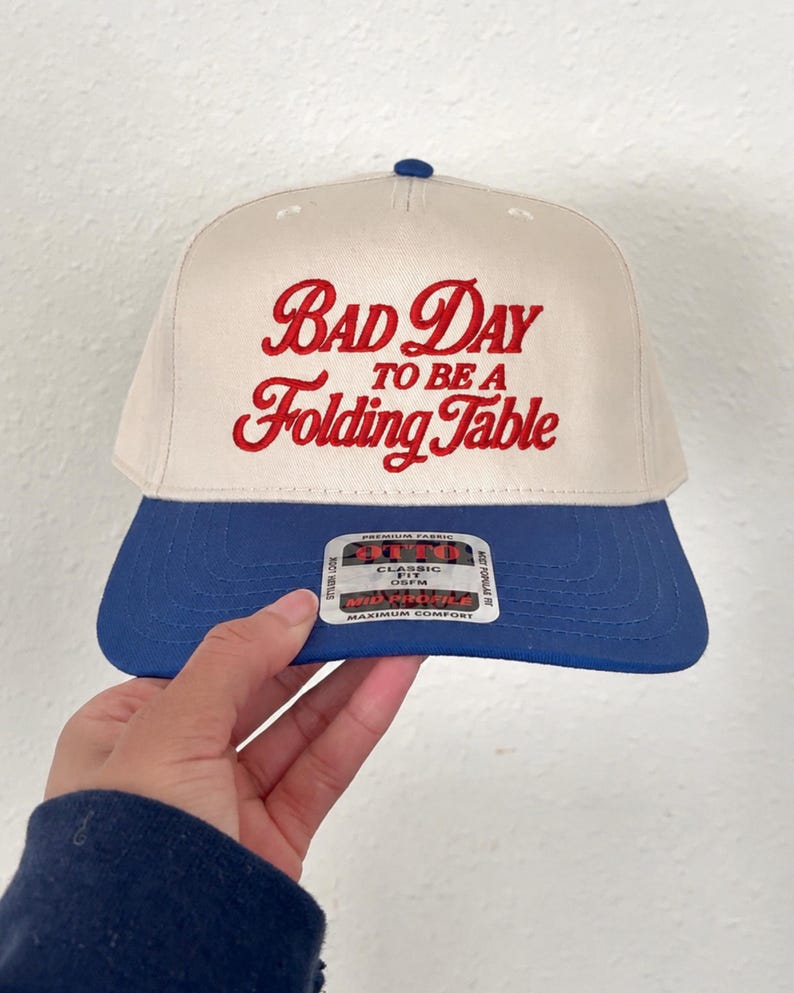 Buffalo Football, Bad day to be a folding table, Football tailgating, fall football season hats, 3d puff embroidery, football gift, game day outfit, customizable hat, puff print, bil football, buffalo bil funny hat, folding hat humor, football humor, football buffalo print 3d puff "bad day to be a folding table" embroidered trucker hat for women, gift for men, gift for bil fans, gift for fans in buffalo new york, funny embroidery for fans