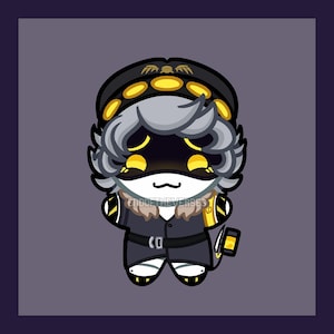May include: A plush toy character with grey hair, wearing a black military-style cap with yellow accents and a black coat with a belt. The character has a black visor with glowing yellow eyes and a small mouth. The text ENDOFTHEVERSES is visible.