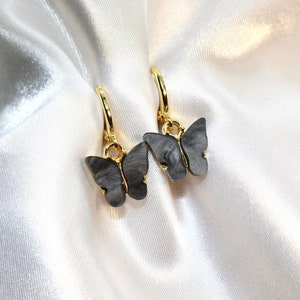 black butterfly huggie earrings