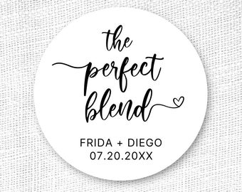 May include: White round sticker with black text that reads "the perfect blend" with a small heart symbol. Below the text is "FRIDA + DIEGO 07.20.20XX".