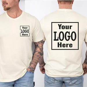 a man wearing a t - shirt with a logo on it