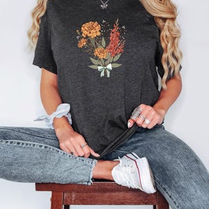 a woman sitting on top of a wooden stool