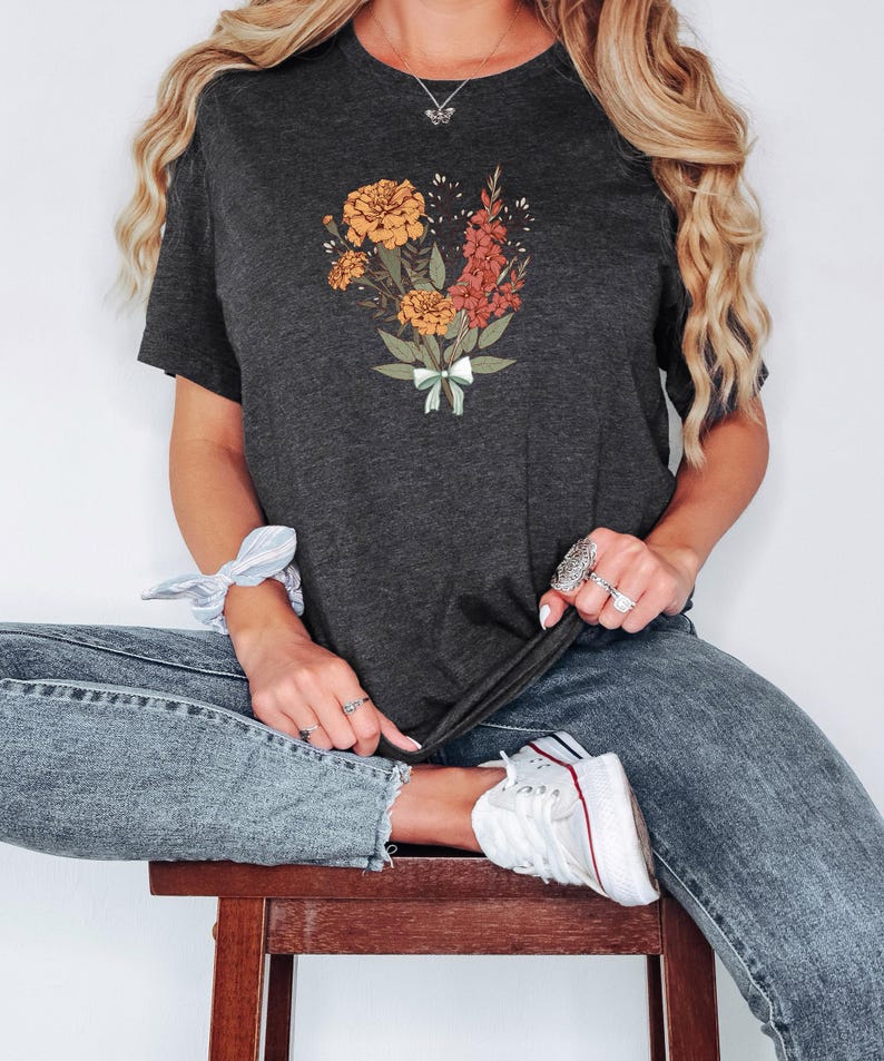 a woman sitting on top of a wooden stool