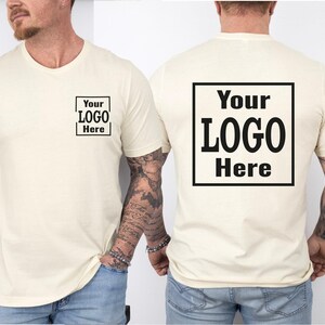 a man wearing a t - shirt with a logo on it