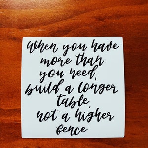 May include: White background with black text that reads "When you have more than you need, build a longer table, not a higher fence."