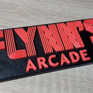 Logo di Flynn's Arcade Tron 1982 / Segno di Flynn's Arcade