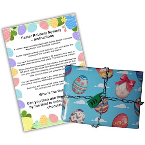 May include: A blue and white gift box with a chain and lock. The box is decorated with Easter eggs and clouds. The text on the accompanying paper reads "Easter Robbery Mystery - Instructions".